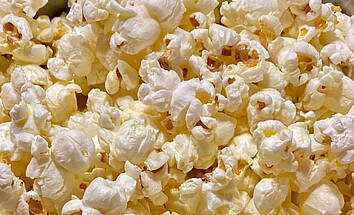 Don’t put popcorn in front of you while watching a movie